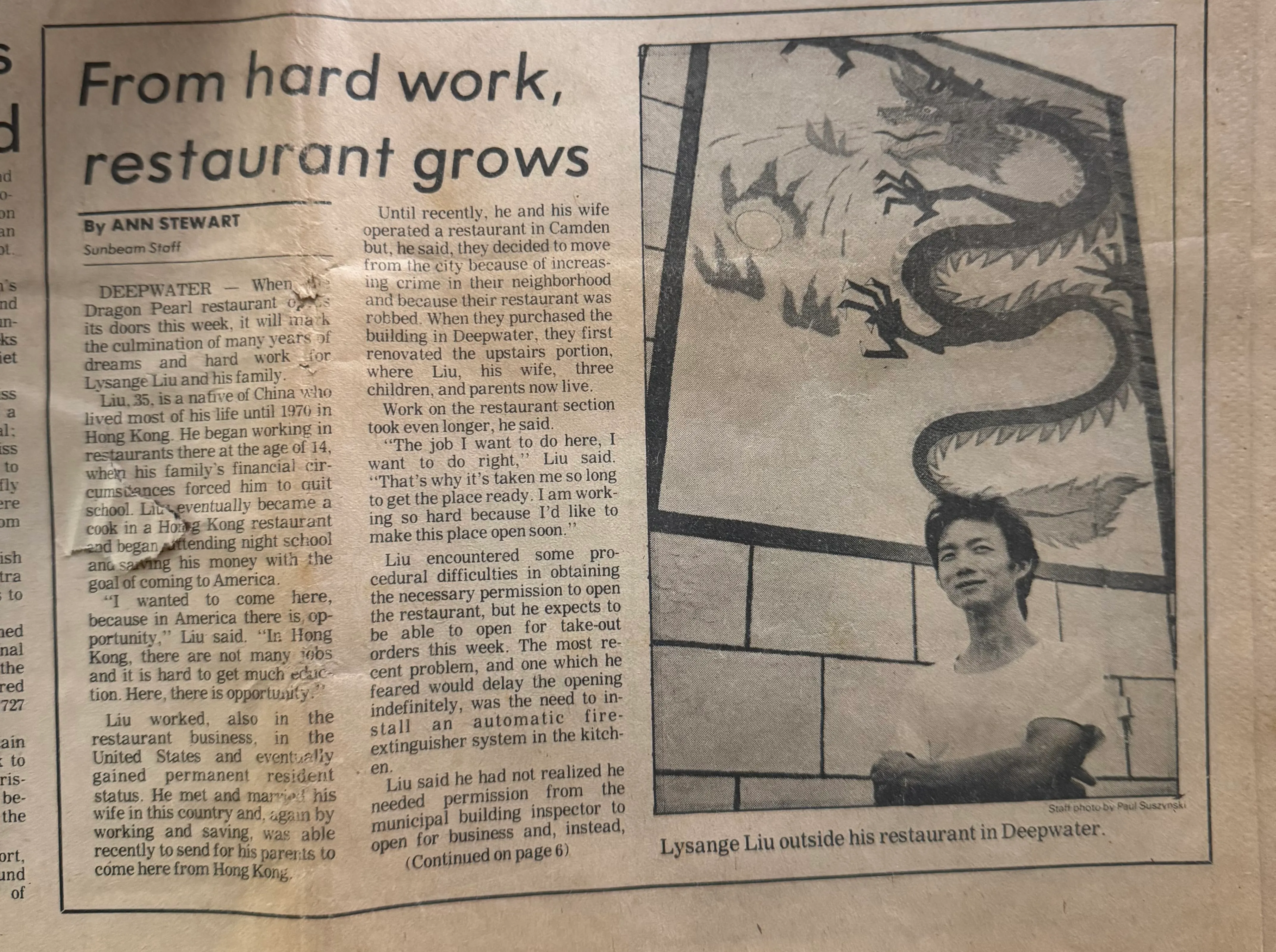 Newspaper article featuring the Dragon Pearl restaurant and the dragon mural